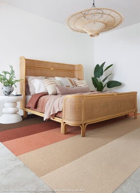 Bedroom featuring FLOR Made You Look shown in Pearl, Tawny, Coral, Spice, Mahogany, and Bark